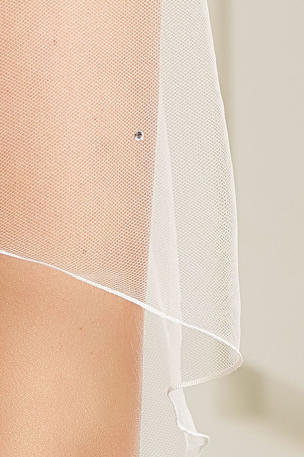 Detail van de Enkellaags soft tule sluier tot kuithoogte